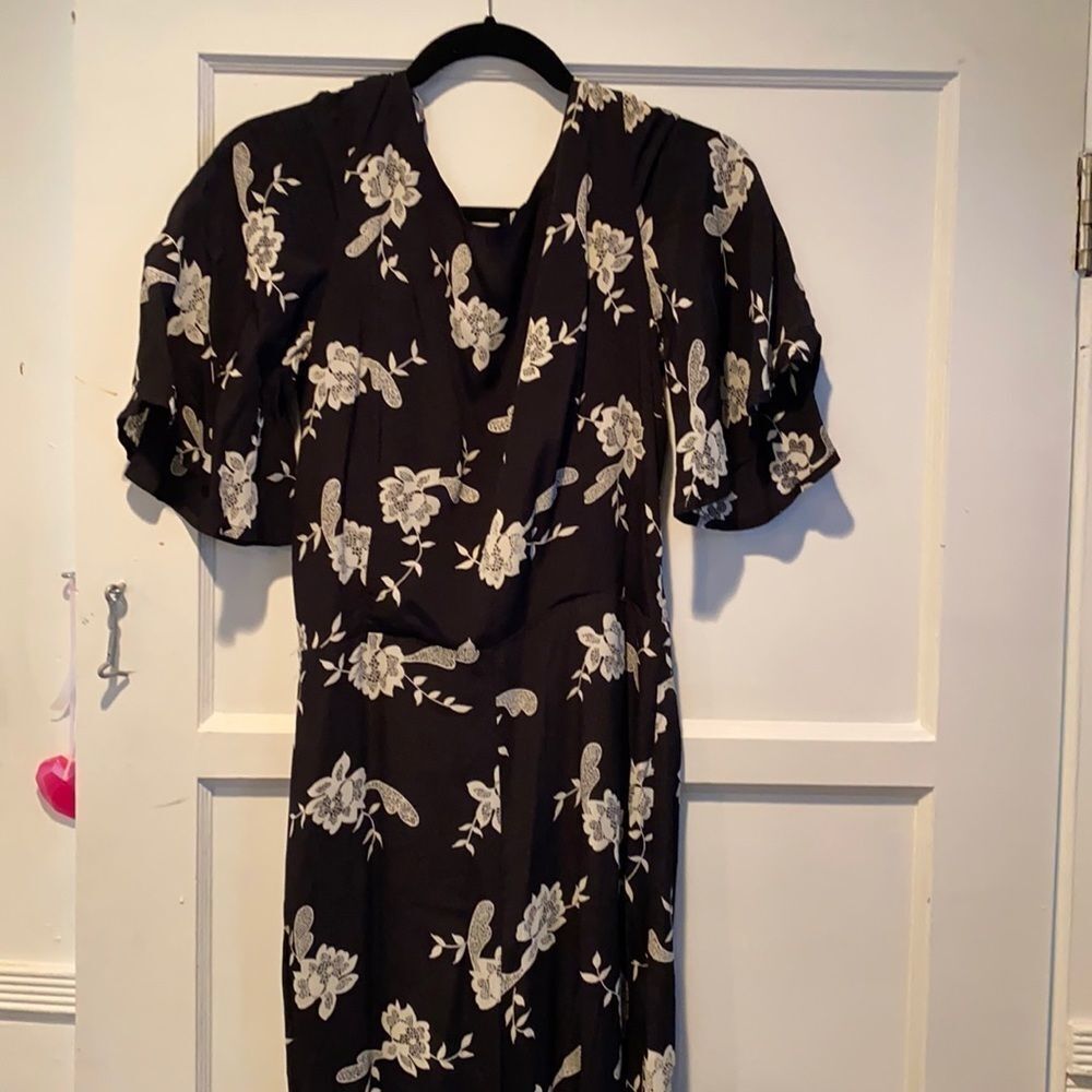 Black floral pattern romper.